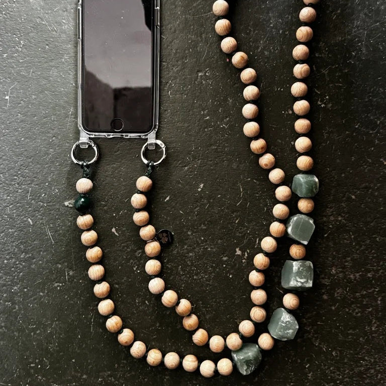 upbeads wooden bead chain a a phone chain on a dark surface