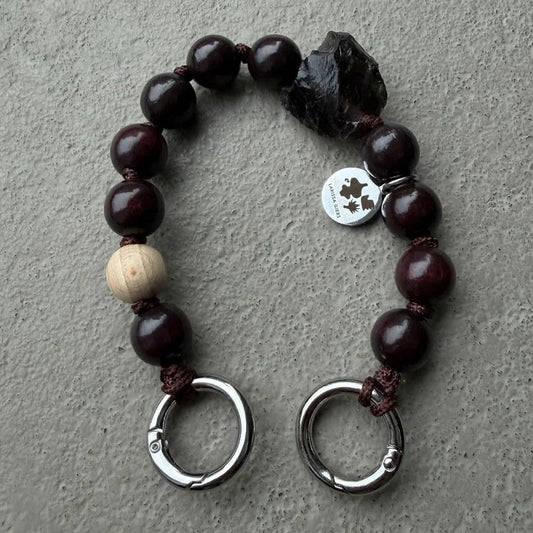 upbeads in collaboration with larissa giers mini smokey chocolate quarz keychain and or cellphone chain. logo is on one side upbeads the opposite side is of larissa giers