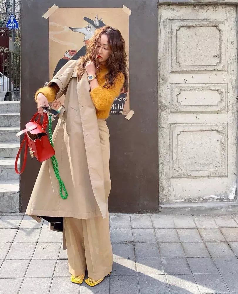 woman in south korea holding her upbeads crossbody cell phone chain handmade in germany wooden beads