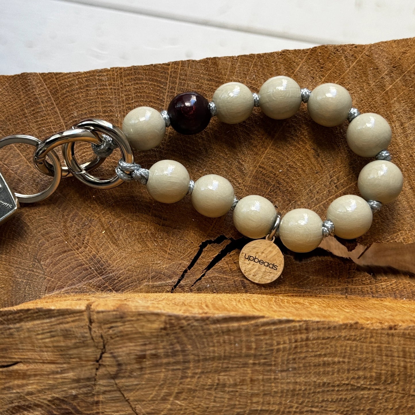 upbeads earl grey mini used as a keychain