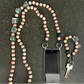 upbeads beaded cellphone chain and keychain on a dark surface