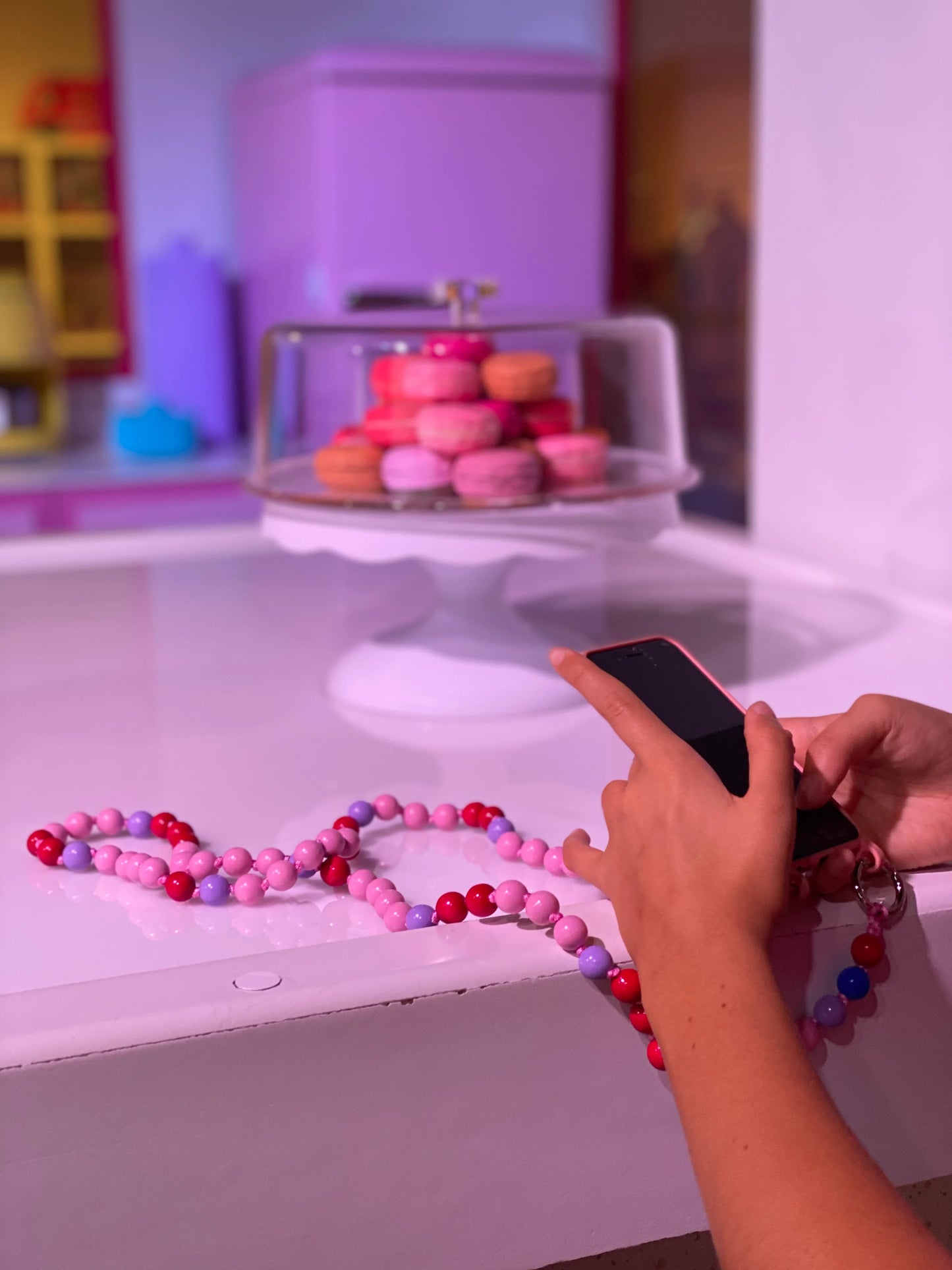 AQUA MIDI cell phone chain / key chain MIDI UPBEADS in action connected to a cellphone case with rings loops