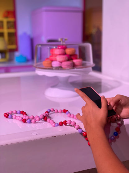 AQUA MIDI cell phone chain / key chain MIDI UPBEADS in action connected to a cellphone case with rings loops