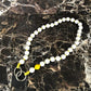 LAVAN YELLOW SHORTIE cell phone chain SHORTIE UPBEADS on black marble