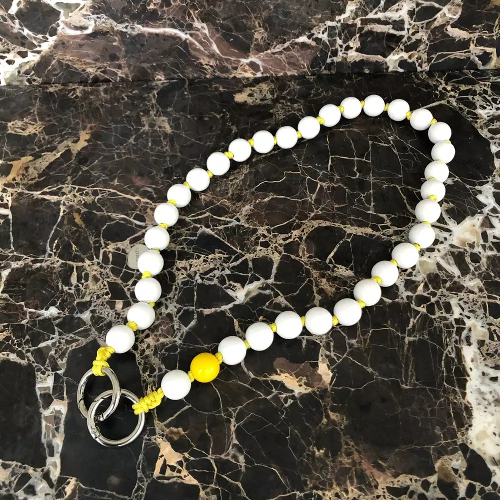 LAVAN YELLOW SHORTIE cell phone chain SHORTIE UPBEADS on black marble