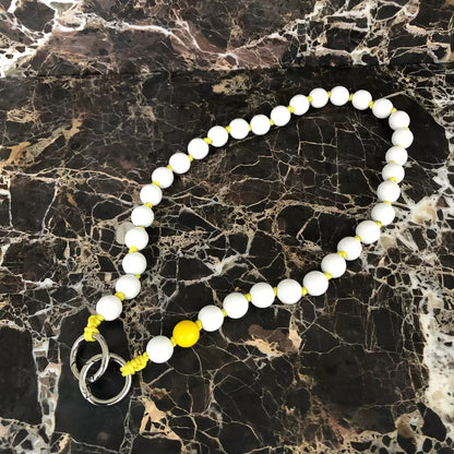 LAVAN YELLOW SHORTIE cell phone chain SHORTIE UPBEADS on black marble