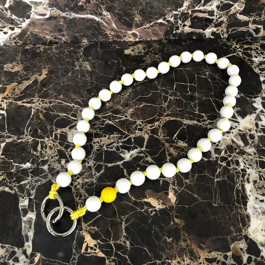 LAVAN YELLOW SHORTIE cell phone chain SHORTIE UPBEADS on black marble