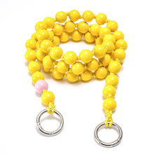 Load image into Gallery viewer, crossbody upbeads yellow beads pink signature beads rolled up product shot wooden beads handmade yellow