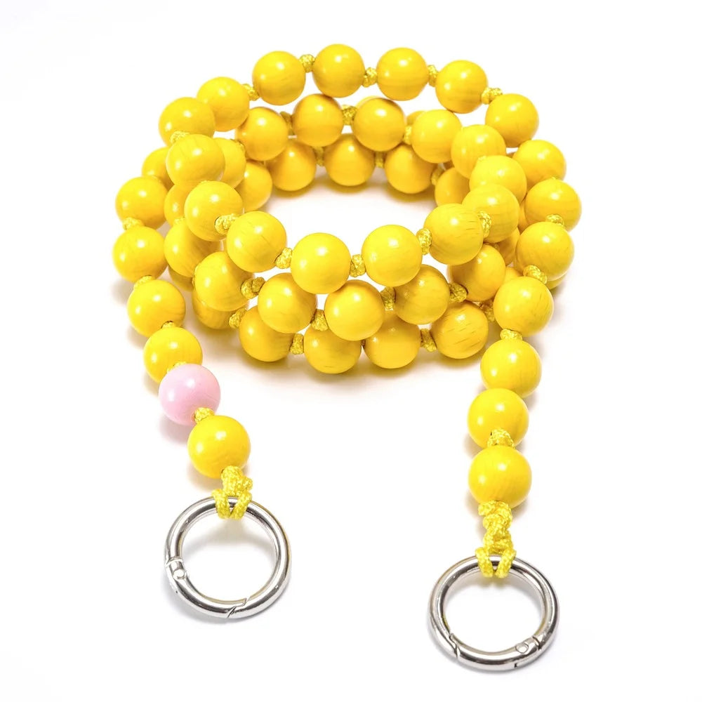 crossbody upbeads yellow beads pink signature beads rolled up product shot wooden beads handmade yellow