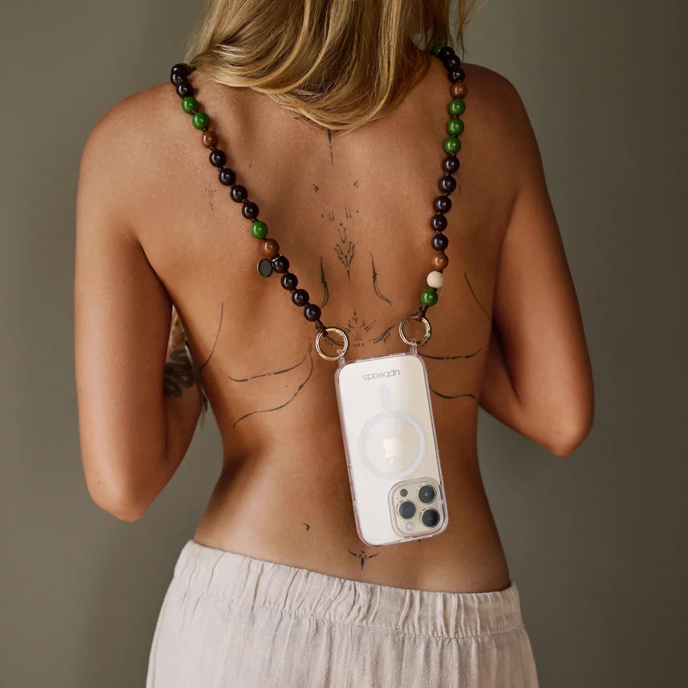 nema crossbody chain worn on a model  directly on skin attached to an iphone with upbeads case