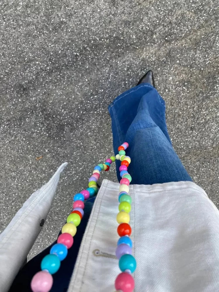 confetti upbeads looking down to the street and colorfull pastel beads chain