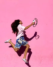 Load image into Gallery viewer, midi junglebeads upbeads attached to ipone while girl jumps with pink background