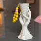 mini yellow sunsun upbeads in a ice cone vase