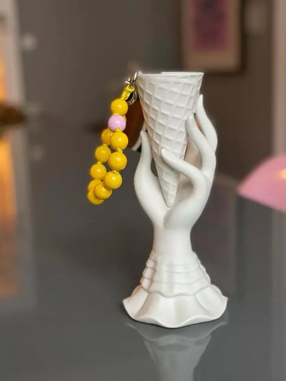 mini yellow sunsun upbeads in a ice cone vase