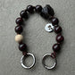 upbeads in collaboration with larissa giers mini smokey chocolate quarz keychain and or cellphone chain. logo is on one side upbeads the opposite side is of larissa giers