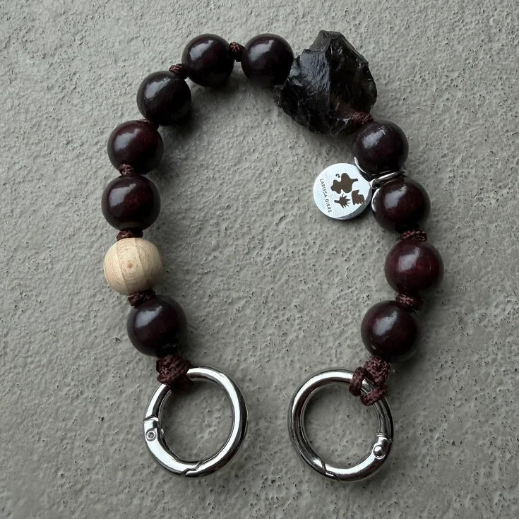 upbeads in collaboration with larissa giers mini smokey chocolate quarz keychain and or cellphone chain. logo is on one side upbeads the opposite side is of larissa giers