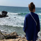 lavan blue blau crossbody upbeads ocean beach waves girl watching waves wearing upbeads lavan blue