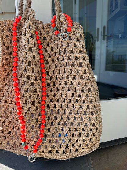 foxy upbeads crossbody and mini cellphone chain attached to a straw bag 