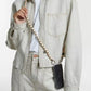 upbeads crossbody cellphone chain on woman dressed in white jeans and white closed jeans jacket crossbodyupbeads crossbody cellphone chain on woman dressed in white jeans and white closed jeans jacket crossbody