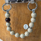 upbeads mini greige earl grey beige attached to a cellphone case used as cellphone chain