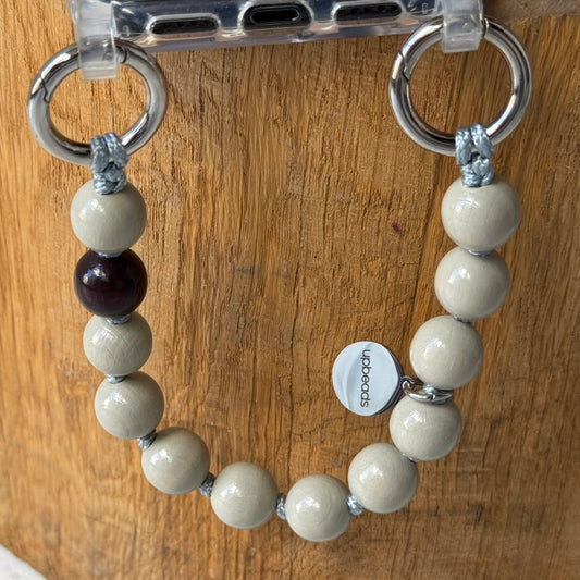 upbeads mini greige earl grey beige attached to a cellphone case used as cellphone chain