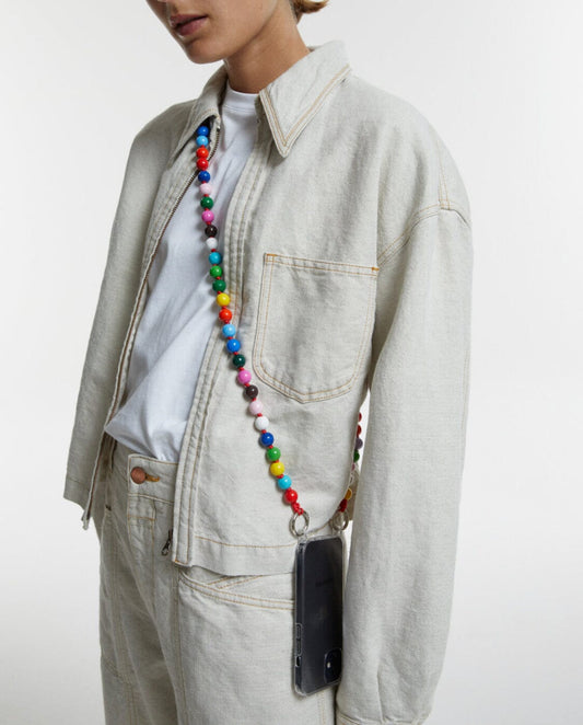 upbeads cellphone chain in happy worn by a CLOSED model